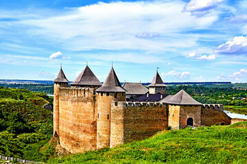 An old fortress on the green hills by the river