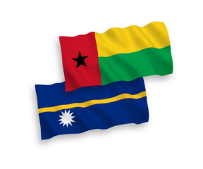 National vector fabric wave flags of Republic of Guinea Bissau and Republic of Nauru isolated on white background. 1 to 2 proportion.