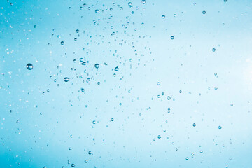 Bubbles of water on blue background