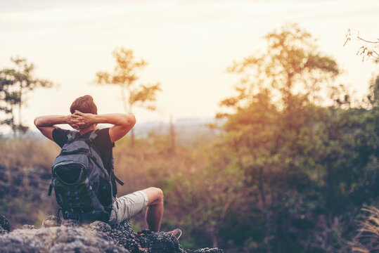 Hiker Man Backpack Walking Trail Activity Camping Outdoors For Destination Leisure.  People Happy Feeling Freedom Good And Strong Weight Victorious Facing On The Natural Mountain