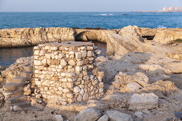 Coastal view with ruined stone fortifications. Egypt