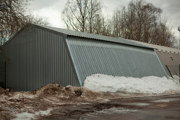 Metal warehouse outside. Storage room for municipal equipment.