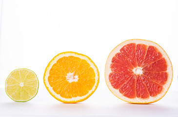 section of grapefruit, orange and lime on a white background, isolate. The concept of vitamins, freshness, naturalness. High quality photo