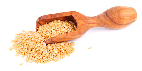 Golden flax seeds in wooden scoop, isolated on white background. Heap of dry flaxseed or linseed.