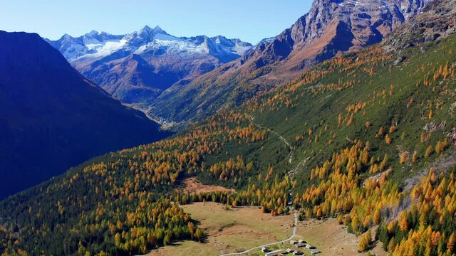 Aerial 4K, autumnal view of Alpe Entova in Valmalenco, Italy	