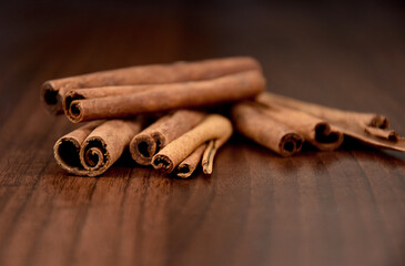 Fragrant cinnamon sticks stock images. Cinnamon sticks on a wooden background stock photo