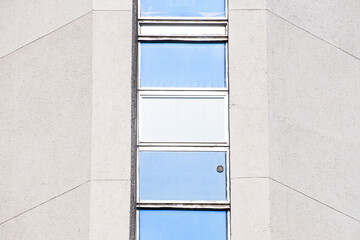 Abstract architectural detail of a concrete office building window section from the isolated facade