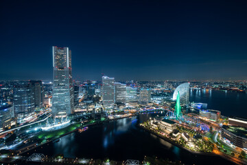 Fototapeta na wymiar Yokohama Minato Mirai 21 seaside urban area in central Yokohama with Landmark tower at Magic hour