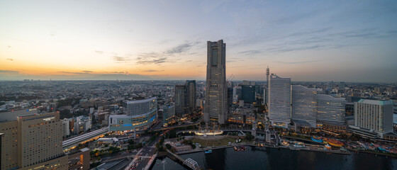 Fototapeta premium Yokohama Minato Mirai 21 seaside urban area in central Yokohama with Landmark tower at sunset time.