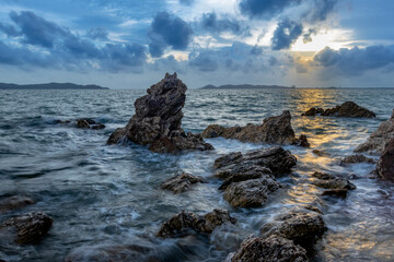 Fototapeta na wymiar long exposure landscape, sea, rocks, clouds, sky, sunset