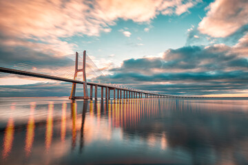 Sunrise at the Ponte Vasco da Gama, the longest bridge in Europe, situated in Lisbon, Portugal