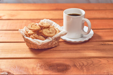 Palm cookies or puff pastry ears on a rustic background.