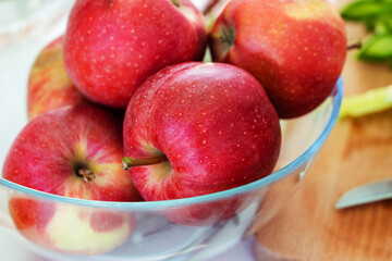Red apples in a glass plate. Ingredient for making confectionery. Close-up