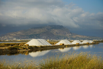 Trapani salt flats and Erice view at the sunset, Sicily, Italy