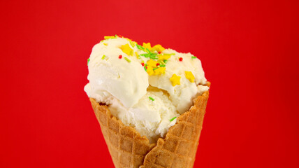 Ice cream in a waffle glass on a red background
