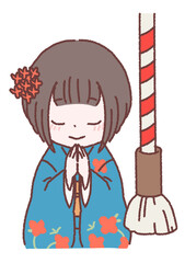 着物で初詣、参拝をする女性
