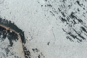 chipped white paint on broken scratched glass