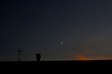 The roof of the house at sunset.