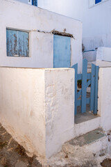 Folegandros island, Greece, Cyclades. Small white house with blue door in Kastro