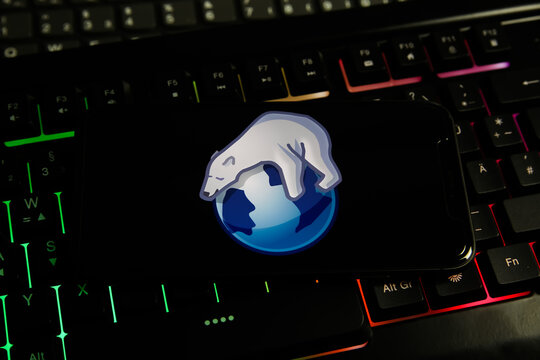 Viersen, Germany - June 9. 2021:  Closeup of mobile phone screen with logo lettering of arora browser on computer keyboard