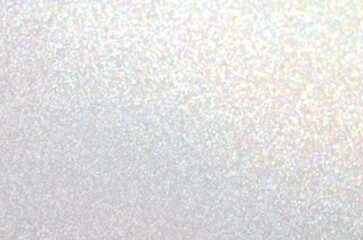 White glistening textured background with iridescent sparkles.