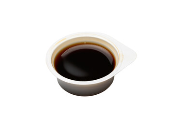 Plastic open disposable container with soy sauce. Isolated on a white background