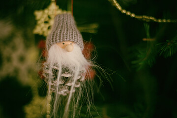 Detail of christmas tree decoration. Merry Christmas and happy New Year, 24th of December. Close up view of Christmas tree twig with ornaments