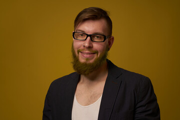 Obraz premium bearded man in a black jacket with a book in his hands education