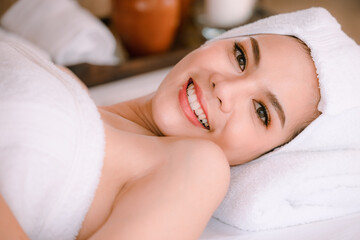 Fototapeta na wymiar Beautiful Woman Relaxing in Spa Salon