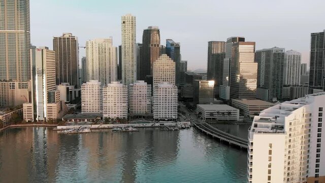 Amazing Downtown Miami aerial skyline from Brickell Key on a sunny morning, Florida in slow motion