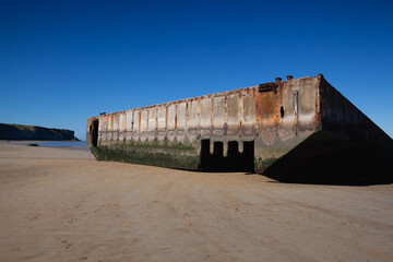 Arromanches beach with rusting floating pontoons, Normandy