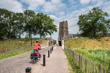 Foto auf Leinwand The Martinuskerk is a medieval cruciform church in the fortified town of Woudrichem, Noord-Brabant Province, The Netherlands © Holland-PhotostockNL