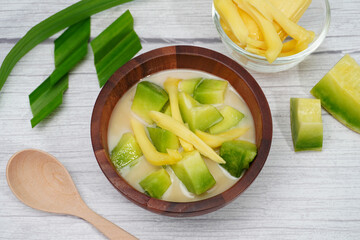 Thai dessert, melon and yellow jackfruit Topped with sugar syrup, fresh coconut milk and pandan...