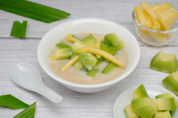Thai dessert, melon and yellow jackfruit Topped with sugar syrup, fresh coconut milk and pandan leaves add aroma