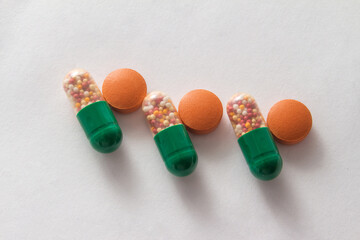 pills, capsules, multi-colored, antibiotics, vitamins, scattered, medicine, hospital, white background, treatment, prescription, help, sick, dosage, health