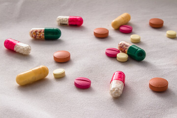 pills, capsules, multi-colored, antibiotics, vitamins, scattered, medicine, hospital, white background, treatment, prescription, help, sick, dosage, health