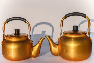 Two Copper desert tea pot, antique metal teapot isolated on white background, antique kettle,...