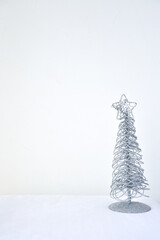 Christmas tree with glitters and white background