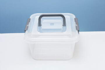 white plastic square container with grey handle