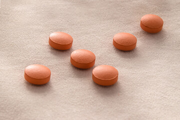 medicines, tablets, round, brown, textured background, geometry, composition, medicines, health, prescription, dosage, coronavirus treatment, hospital, help, antiviral, antibiotics, vitamins