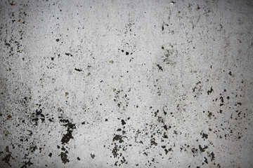 Grunge white colored Wall with cracks and scratches on it. Creative surface paint White colored and wounded background. 