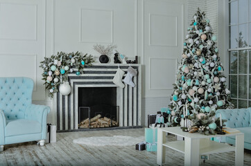 A beautiful New Year's interior with a large, decorated with toys standing near the fireplace.
