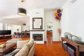 Modern traditional European living room with fireplace and coffee table and TV.