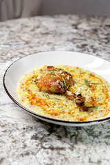 risotto in white dish on marble table