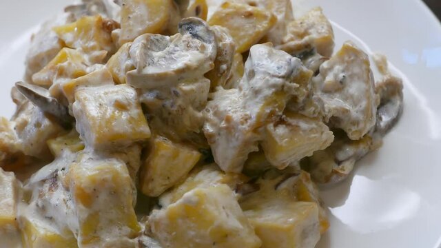 Vegetarian stew with mushrooms, turnip and potatoes with cheese sauce
