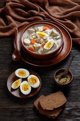 Zurek polish soup with white kielbasa on a bowl