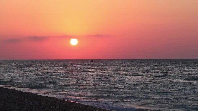 The most beautiful colorful sunset at Ialysos Beach Rhodes Greece.