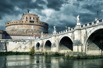 Castel Sant'Angelo and Ponte Sant'Angelo in Rome, Italy. Famous castle under dramatic sky.