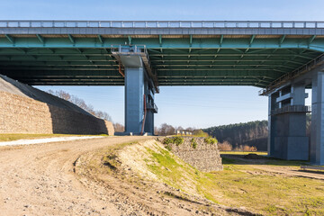 Fototapeta na wymiar huge car bridge across the wide river