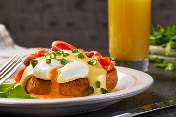 Eggs Benedict with salmon and hollandaise sauce